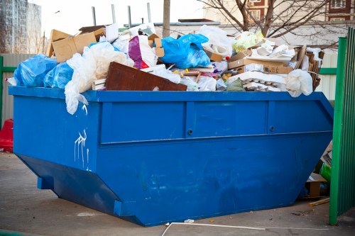 Company van and crew at commercial waste pickup site